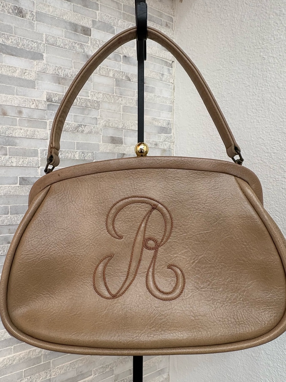 Vintage-style tan leather frame handbag